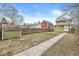 Spacious backyard featuring a shed, lush lawn, and a walkway leading to the house at 827 N Tacoma Ave, Indianapolis, IN 46201