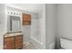 Bathroom features a large mirror, wooden vanity, and shower-tub combo at 827 N Tacoma Ave, Indianapolis, IN 46201