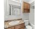 Bathroom features a large mirror, wooden vanity, and shower-tub combo at 827 N Tacoma Ave, Indianapolis, IN 46201
