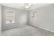 Bedroom featuring neutral walls, carpet floors, and two windows with blinds at 827 N Tacoma Ave, Indianapolis, IN 46201