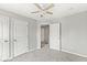 Bedroom featuring neutral walls, carpet floors, three doors, and a ceiling fan at 827 N Tacoma Ave, Indianapolis, IN 46201