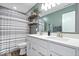 Bright bathroom with a double sink vanity, modern fixtures, and stylish shelving for storage at 8861 Linton Ln, Brownsburg, IN 46112