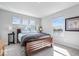Serene bedroom features a wooden bed frame, three windows, and calming views of the water at 8861 Linton Ln, Brownsburg, IN 46112
