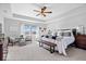 Bright and airy main bedroom with a ceiling fan, large window, and stylish furnishings at 8861 Linton Ln, Brownsburg, IN 46112