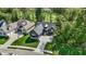Stunning aerial view of home with a three-car garage and golf course views surrounded by lush greenery at 907 Oak Terrace Rd, Westfield, IN 46074