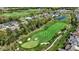 Scenic aerial view of a golf course community with well-manicured lawns and stunning water features at 907 Oak Terrace Rd, Westfield, IN 46074