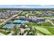 Stunning aerial view of a golf course community featuring a clubhouse, pool, tennis courts, and beautiful homes at 907 Oak Terrace Rd, Westfield, IN 46074