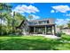 Stunning home exterior with covered patio, lush lawn, and beautiful landscaping, perfect for outdoor living at 907 Oak Terrace Rd, Westfield, IN 46074