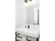 Bathroom featuring white floating vanity, matte black hardware, frameless rectangular mirror and modern decor at 907 Oak Terrace Rd, Westfield, IN 46074
