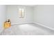 Clean bedroom with a window, neutral carpet, and minimal furniture at 907 Oak Terrace Rd, Westfield, IN 46074