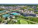 Overhead view of the community clubhouse featuring tennis courts, pool, and meticulously maintained grounds at 907 Oak Terrace Rd, Westfield, IN 46074