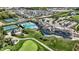 Elevated aerial view of resort-style amenities including tennis, pool, and clubhouse in a community setting at 907 Oak Terrace Rd, Westfield, IN 46074