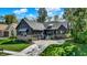 Attractive home with three-car garage, well-maintained lawn, elegant brick accents, and inviting front entry at 907 Oak Terrace Rd, Westfield, IN 46074