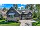 Lovely home features a three-car garage, brick accents, mature trees, and an inviting walkway to the front door at 907 Oak Terrace Rd, Westfield, IN 46074