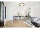 Bright foyer features hardwood floors, modern light fixture, and a decorative console table at 907 Oak Terrace Rd, Westfield, IN 46074