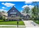 Charming home boasts professional landscaping, a brick facade, and a driveway leading to an attached garage at 907 Oak Terrace Rd, Westfield, IN 46074