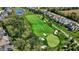Aerial view of a meticulously maintained golf course with lush green fairways and sand traps at 907 Oak Terrace Rd, Westfield, IN 46074