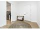 Hallway with decorative rug leads to other rooms in home; laundry room visible in background at 907 Oak Terrace Rd, Westfield, IN 46074