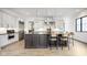 Modern kitchen features stainless steel appliances, custom cabinets, and a beautiful center island with seating at 907 Oak Terrace Rd, Westfield, IN 46074