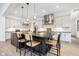 Spacious kitchen with large island, pendant lighting, stainless appliances, and light hardwood flooring at 907 Oak Terrace Rd, Westfield, IN 46074