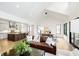 Spacious living room with vaulted ceiling, hardwood floors, and an open concept kitchen and dining area at 907 Oak Terrace Rd, Westfield, IN 46074