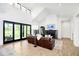 The sun-filled living room features sliding glass doors that provide a view of the private backyard at 907 Oak Terrace Rd, Westfield, IN 46074