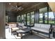 Relaxing covered patio with modern seating and ceiling fan, perfect for outdoor entertaining at 907 Oak Terrace Rd, Westfield, IN 46074