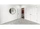 Neutral bedroom featuring gray carpet, white walls, and open door to reveal interior color and texture at 9442 Orchard Cove Dr, Indianapolis, IN 46239