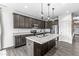 Modern kitchen with granite countertops, stainless steel appliances, and a center island at 9442 Orchard Cove Dr, Indianapolis, IN 46239