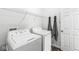 A bright laundry room with a modern washer and dryer, plus plenty of storage space at 9442 Orchard Cove Dr, Indianapolis, IN 46239