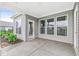 Covered patio with concrete flooring and windows offering views of the backyard at 9442 Orchard Cove Dr, Indianapolis, IN 46239