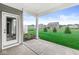 Covered patio featuring a view of the backyard and neighboring homes in a residential area at 9442 Orchard Cove Dr, Indianapolis, IN 46239