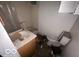 Small bathroom featuring a sink, toilet, and shower at 959 E Georgia St, Indianapolis, IN 46202