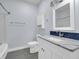 Bathroom featuring gray floors, a white vanity with a marble countertop, and a framed mirror at 9657 Rialto Trl, Carmel, IN 46280