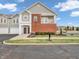 Beautiful two-story townhome with brick facade and attached garages in a great community at 9657 Rialto Trl, Carmel, IN 46280