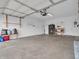 This is a clean and empty two car garage with storage shelves at 9657 Rialto Trl, Carmel, IN 46280