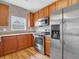 Well-equipped kitchen featuring stainless steel appliances, granite countertops, and ample cabinet space at 9657 Rialto Trl, Carmel, IN 46280