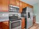 Kitchen featuring stainless steel appliances, granite countertops, and sleek cabinetry at 9657 Rialto Trl, Carmel, IN 46280