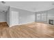 Spacious living room featuring a fireplace, abundant natural light, and modern flooring at 9657 Rialto Trl, Carmel, IN 46280