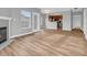 Open living space with fireplace, stylish floors, and view to the kitchen at 9657 Rialto Trl, Carmel, IN 46280