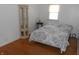 Bedroom with a neutral color scheme and hardwood floors at 10128 E Troy Ave, Indianapolis, IN 46239