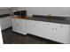 Kitchen with white cabinets, modern appliances, and light countertops at 10128 E Troy Ave, Indianapolis, IN 46239