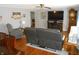 Living room with hardwood floors, and a reclining loveseat at 10128 E Troy Ave, Indianapolis, IN 46239
