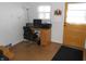 Home office featuring desk, chair, and view of the front yard through the window at 10128 E Troy Ave, Indianapolis, IN 46239