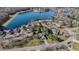 Aerial view of a lakeside community with mature trees and well-manicured lawns at 1110 Butternut Dr, Columbus, IN 47201