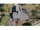An aerial top-down perspective showing the house's roof and the backyard deck at 1110 Butternut Dr, Columbus, IN 47201