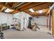 Unfinished basement offering ample space with shelving and exercise equipment setup at 1110 Butternut Dr, Columbus, IN 47201