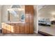 Primary bathroom features a dual vanity with wood cabinets and a separate water closet at 1110 Butternut Dr, Columbus, IN 47201