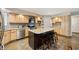 Well-lit kitchen featuring a large island, modern appliances, and granite countertops at 1110 Butternut Dr, Columbus, IN 47201