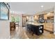 Bright eat-in kitchen boasts stainless steel appliances, light wood cabinets, and breakfast bar seating at 1110 Butternut Dr, Columbus, IN 47201